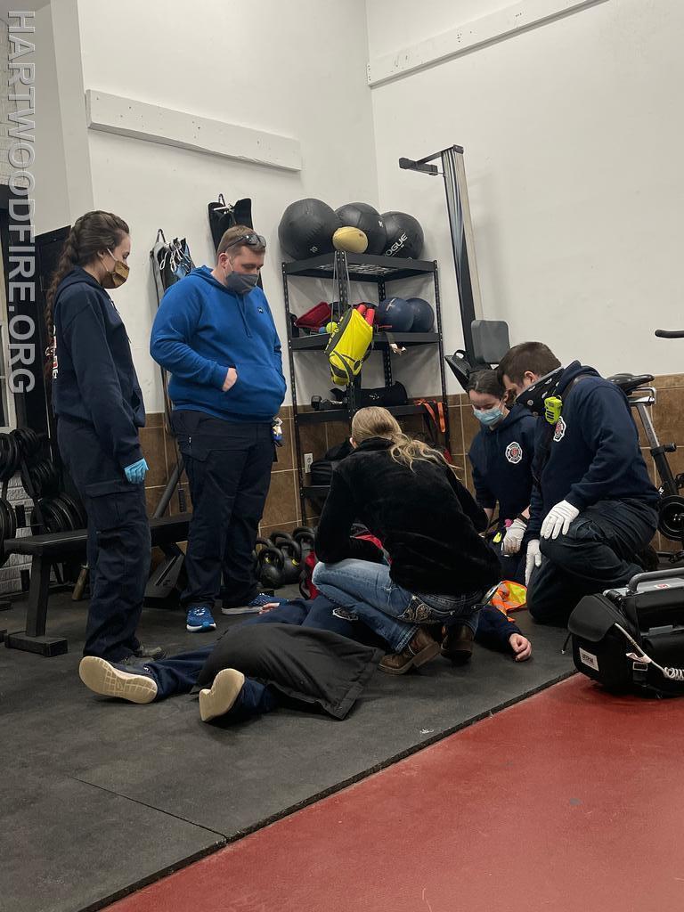 EMT Shook training the group on a trauma call pertaining to injuries from a fall